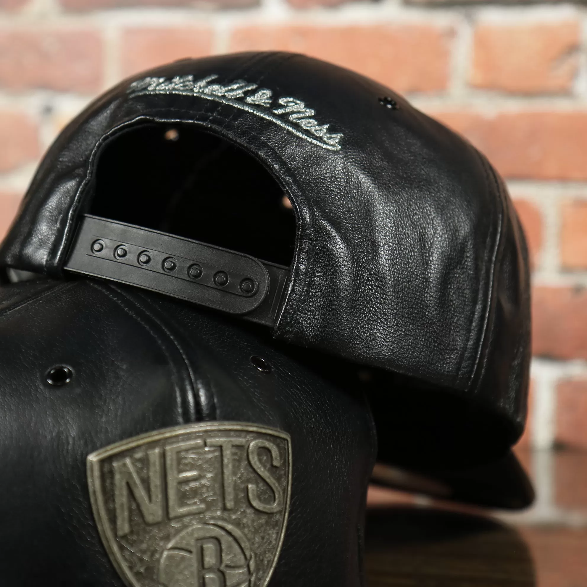 Brooklyn Nets 100% Genuine Lambskin Leather Mitchell and Ness Embossed Metalic Shield Snapback Hat